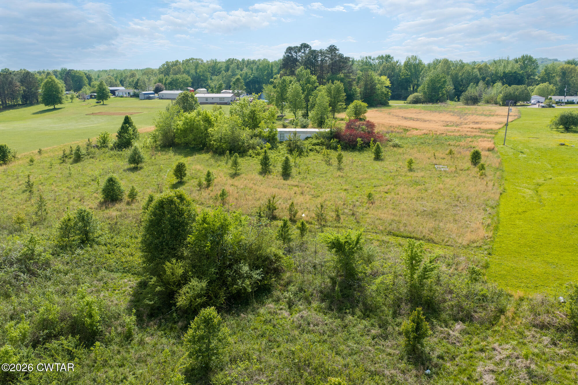 119 Lawrence Road Lexington, TN 38351 - Photo 13 of 20 a view of a lake with houses in background