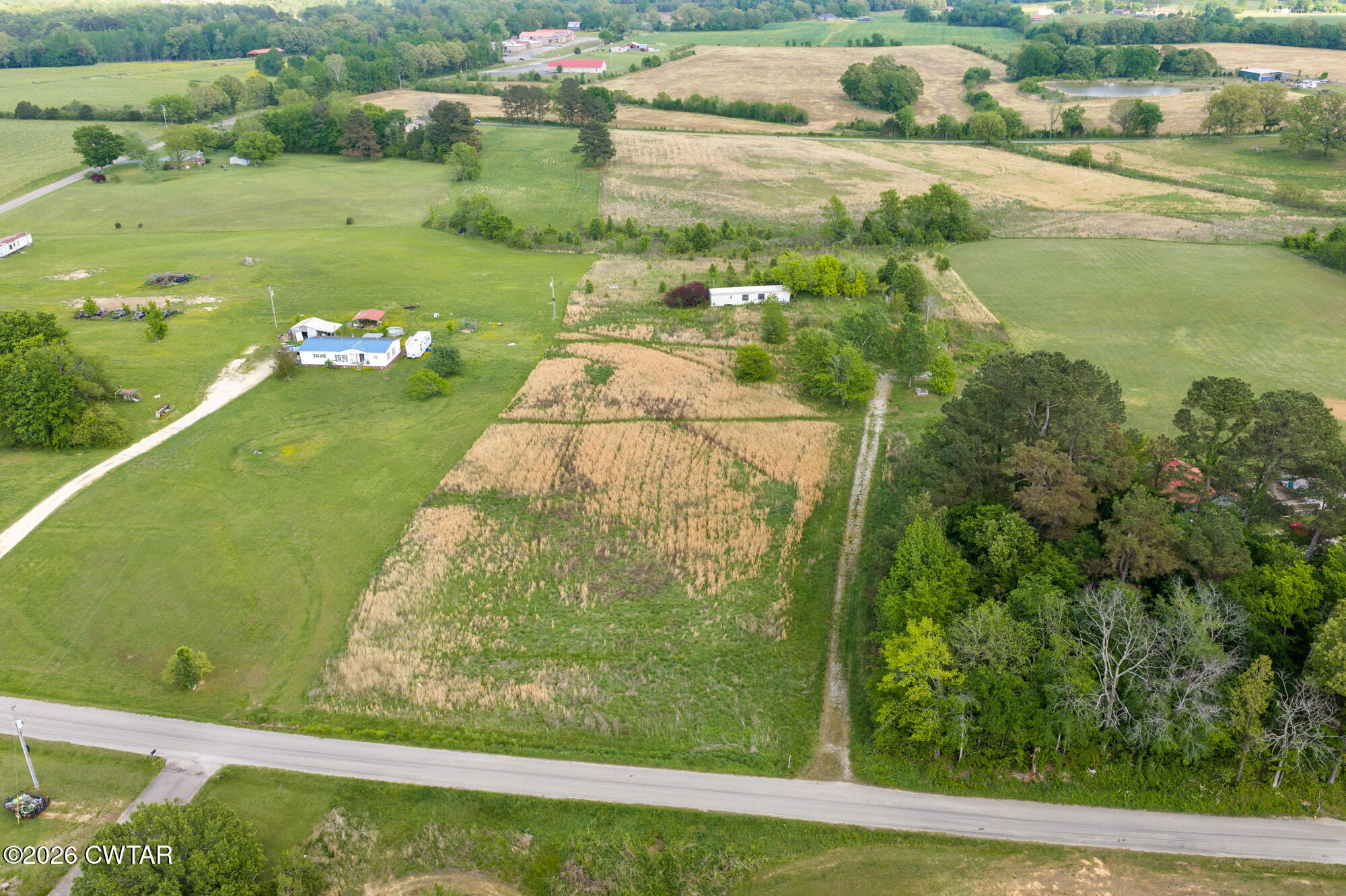 119 Lawrence Road Lexington, TN 38351 - Photo 19 of 20 a view of a lake from a yard