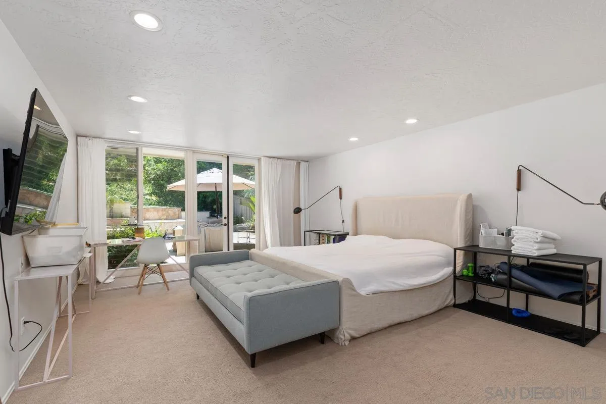 6729 Avenida Andorra La Jolla, CA 92037 - Photo 12 of 27 a bedroom with a bed and large window