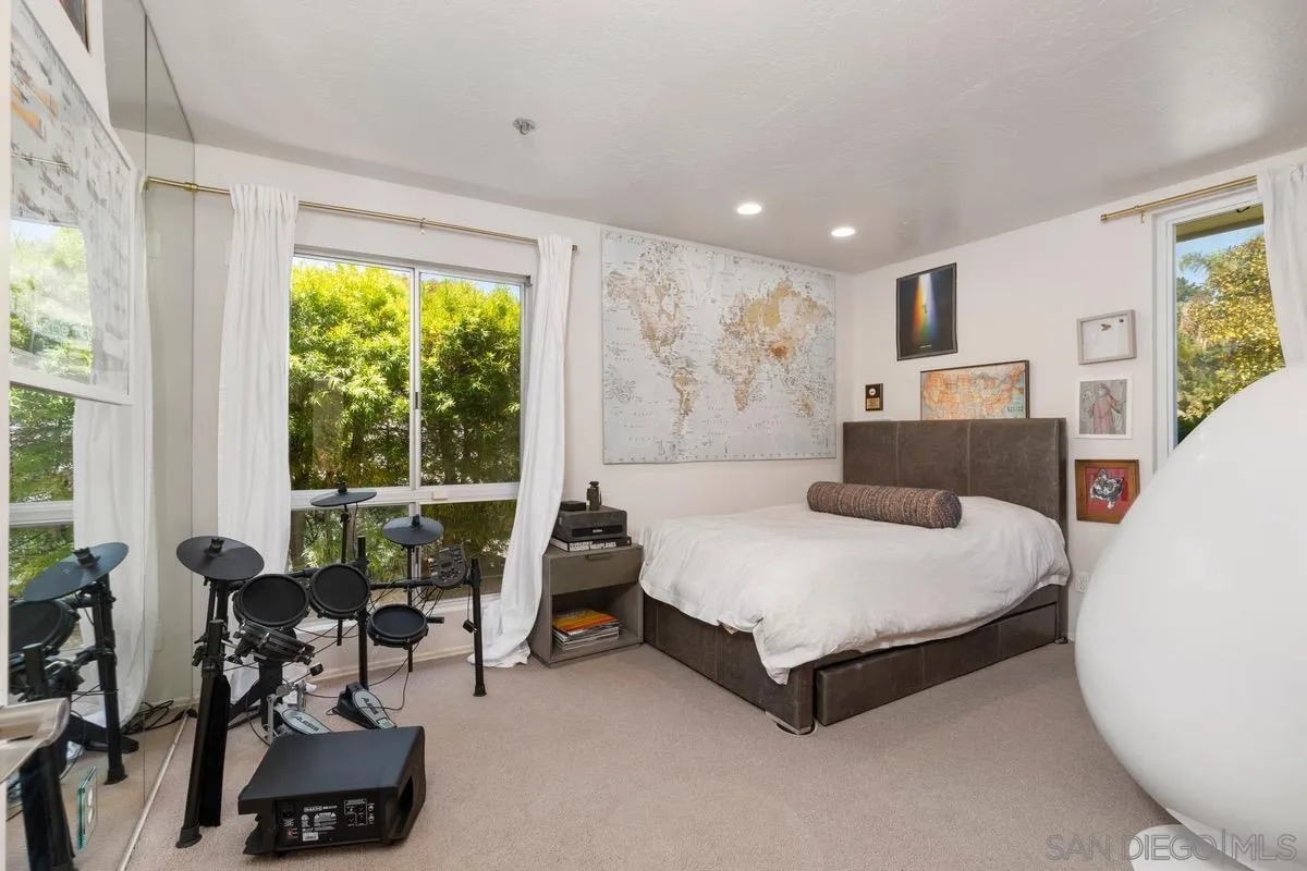 6729 Avenida Andorra La Jolla, CA 92037 - Photo 15 of 27 a spacious bedroom with a bed and a large window