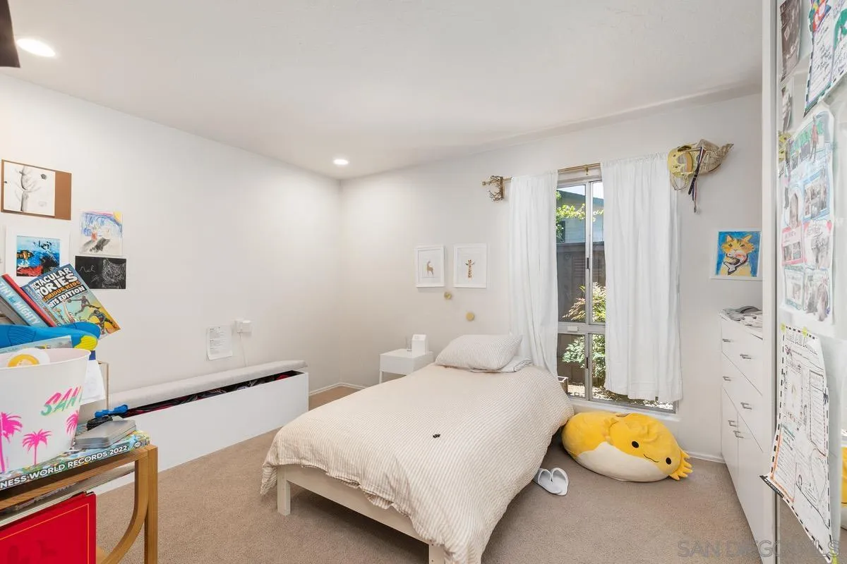 6729 Avenida Andorra La Jolla, CA 92037 - Photo 17 of 27 a bedroom with a bed and a window