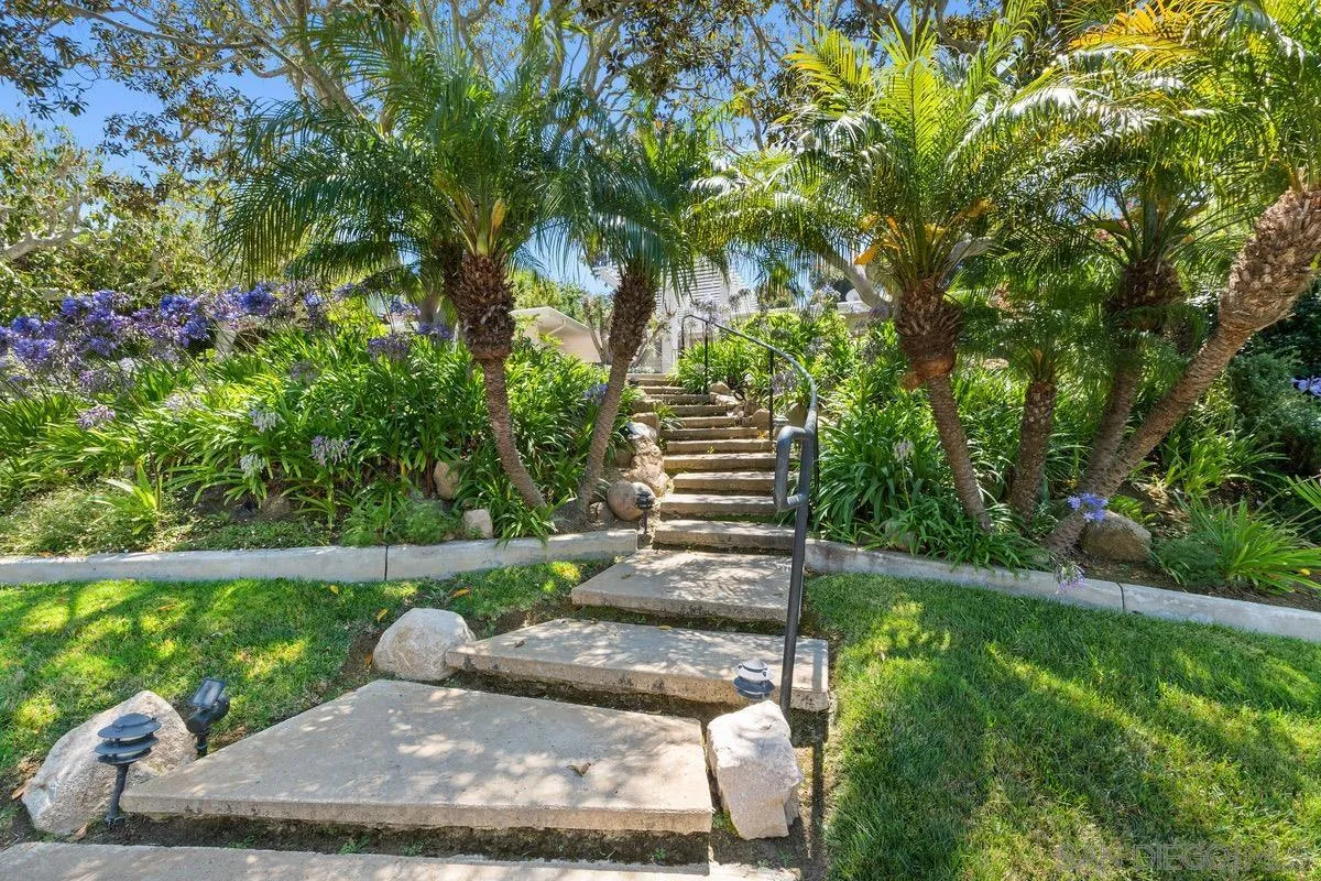 6729 Avenida Andorra La Jolla, CA 92037 - Photo 2 of 27 a view of a backyard with plants and a garden