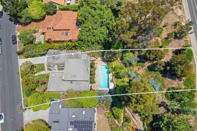 an aerial view of house with a yard