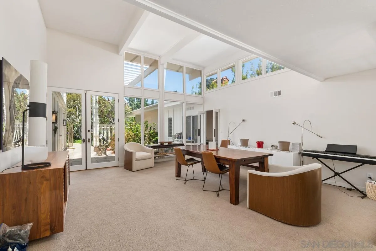 6729 Avenida Andorra La Jolla, CA 92037 - Photo 5 of 27 a living room with furniture and a flat screen tv