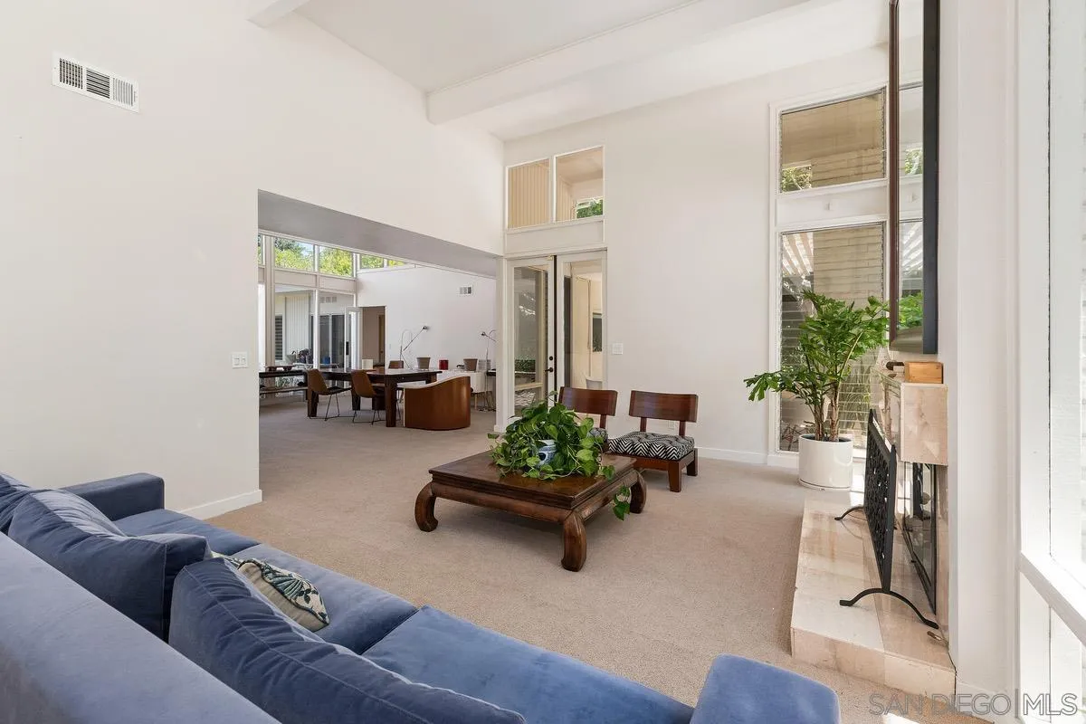 6729 Avenida Andorra La Jolla, CA 92037 - Photo 8 of 27 a living room with furniture and a potted plant