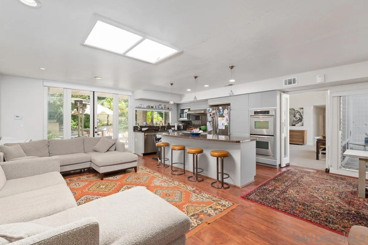 6729 Avenida Andorra La Jolla, CA 92037 - Photo 9 of 27 a living room with furniture and a wooden floor