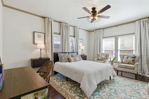 a bedroom with a bed and a couch