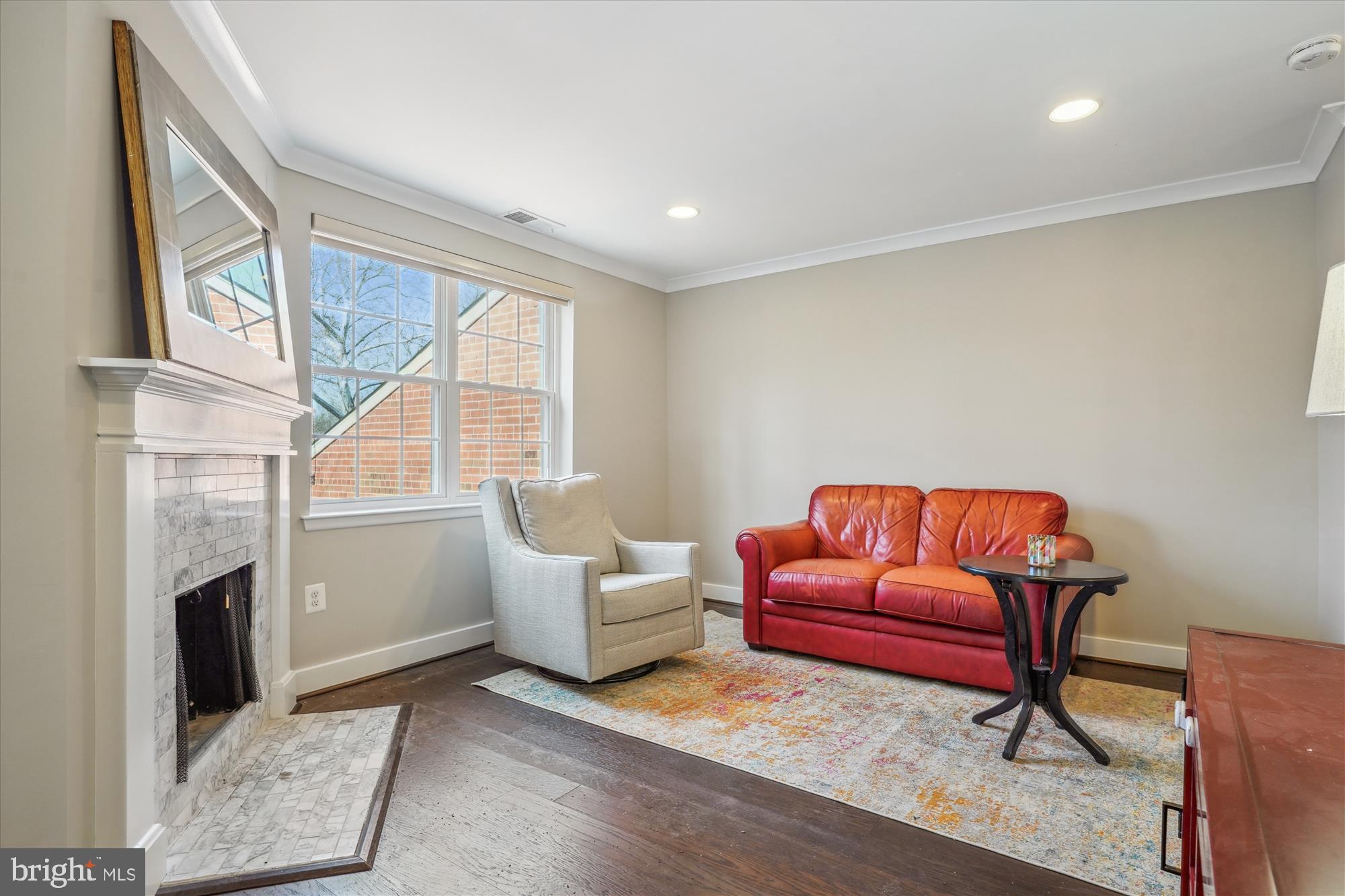 4613 28th Road South, Unit C Arlington, VA 22206 - Photo 12 of 37 a living room with furniture a fireplace and a large window