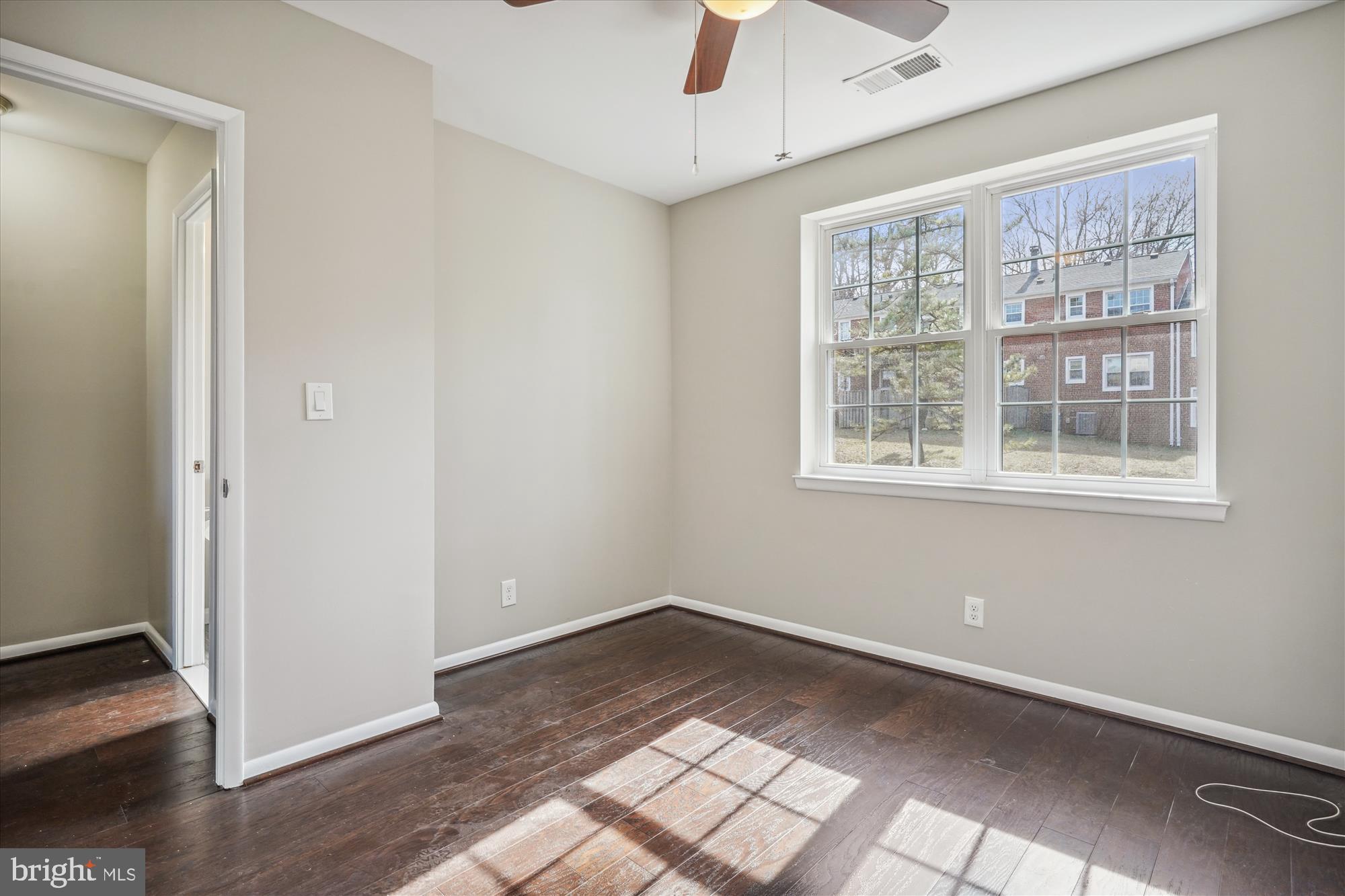 4613 28th Road South, Unit C Arlington, VA 22206 - Photo 20 of 37 a view of empty room with wooden floor and fan