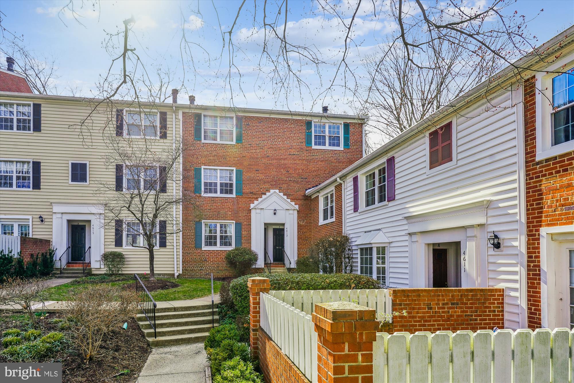 4613 28th Road South, Unit C Arlington, VA 22206 - Photo 2 of 37 a view of a brick house with a yard and large trees