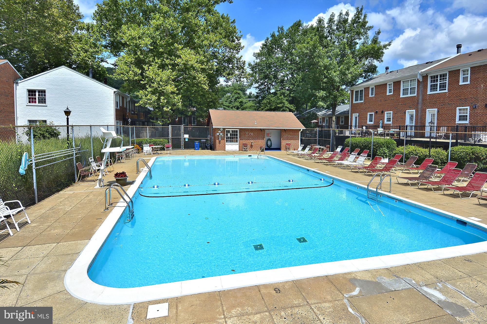 4613 28th Road South, Unit C Arlington, VA 22206 - Photo 31 of 37 a view of a white house with a swimming pool