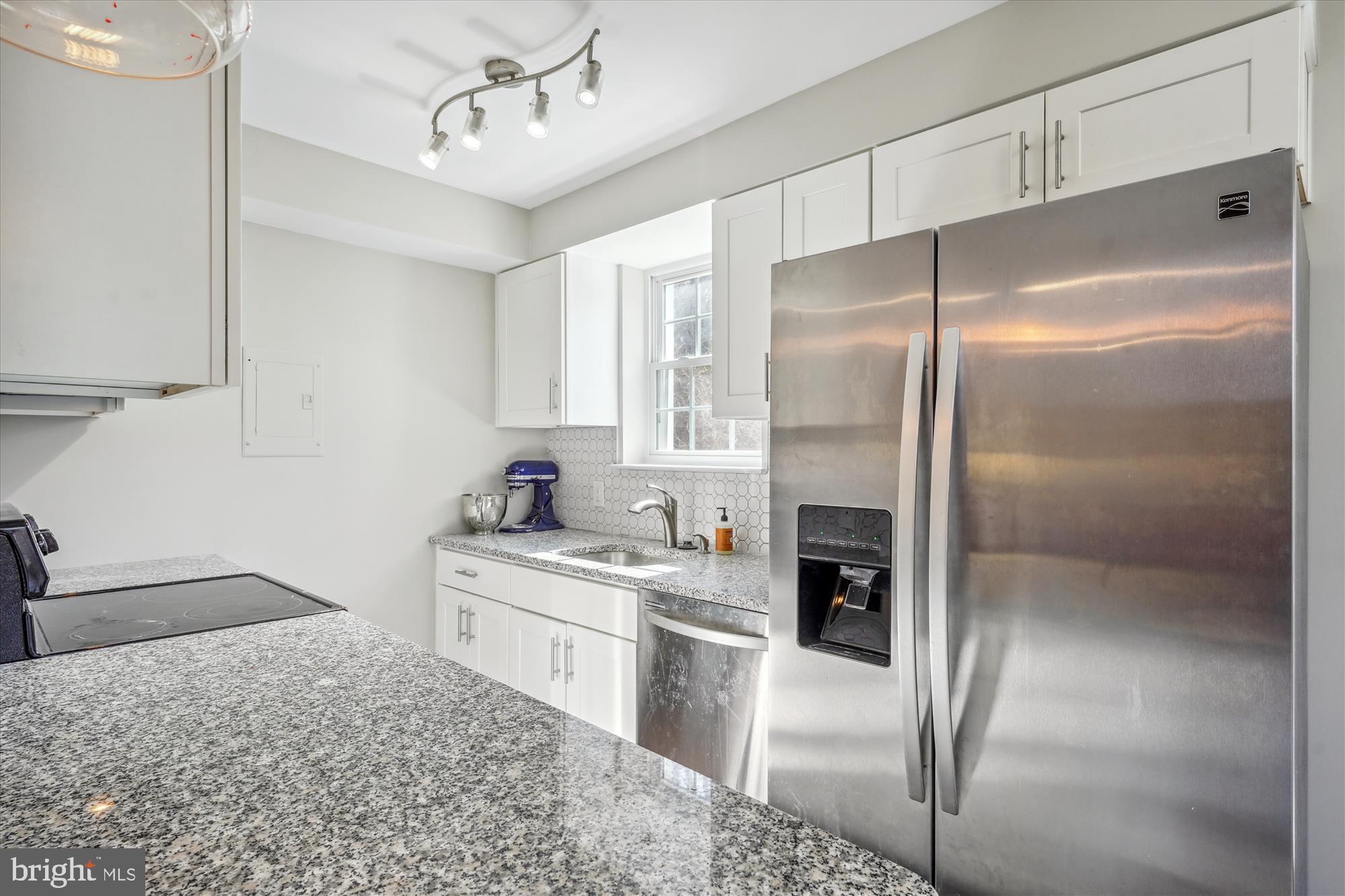 4613 28th Road South, Unit C Arlington, VA 22206 - Photo 4 of 37 a kitchen with a refrigerator and a sink