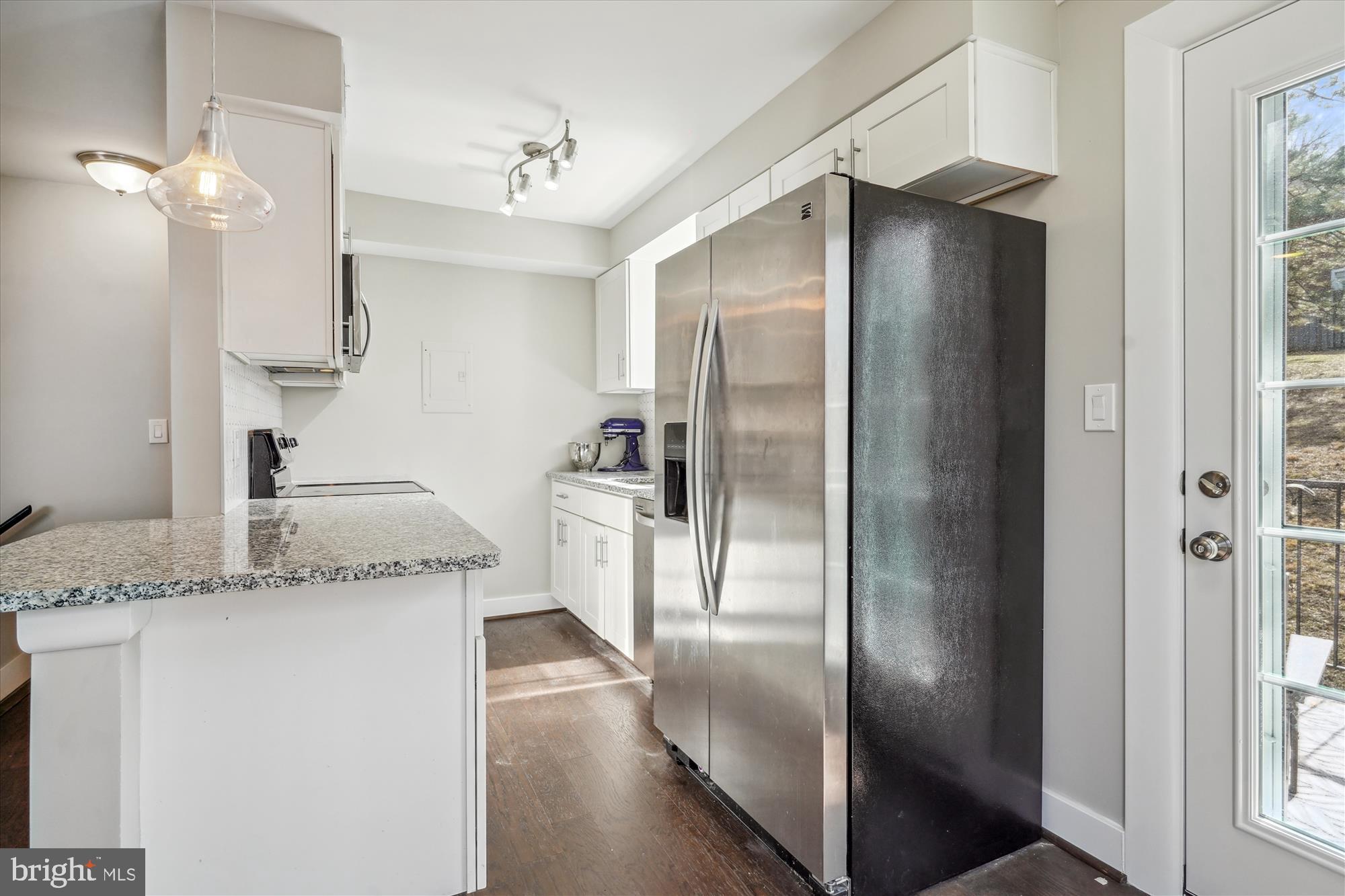 4613 28th Road South, Unit C Arlington, VA 22206 - Photo 6 of 37 a kitchen with stainless steel appliances granite countertop a refrigerator and a sink