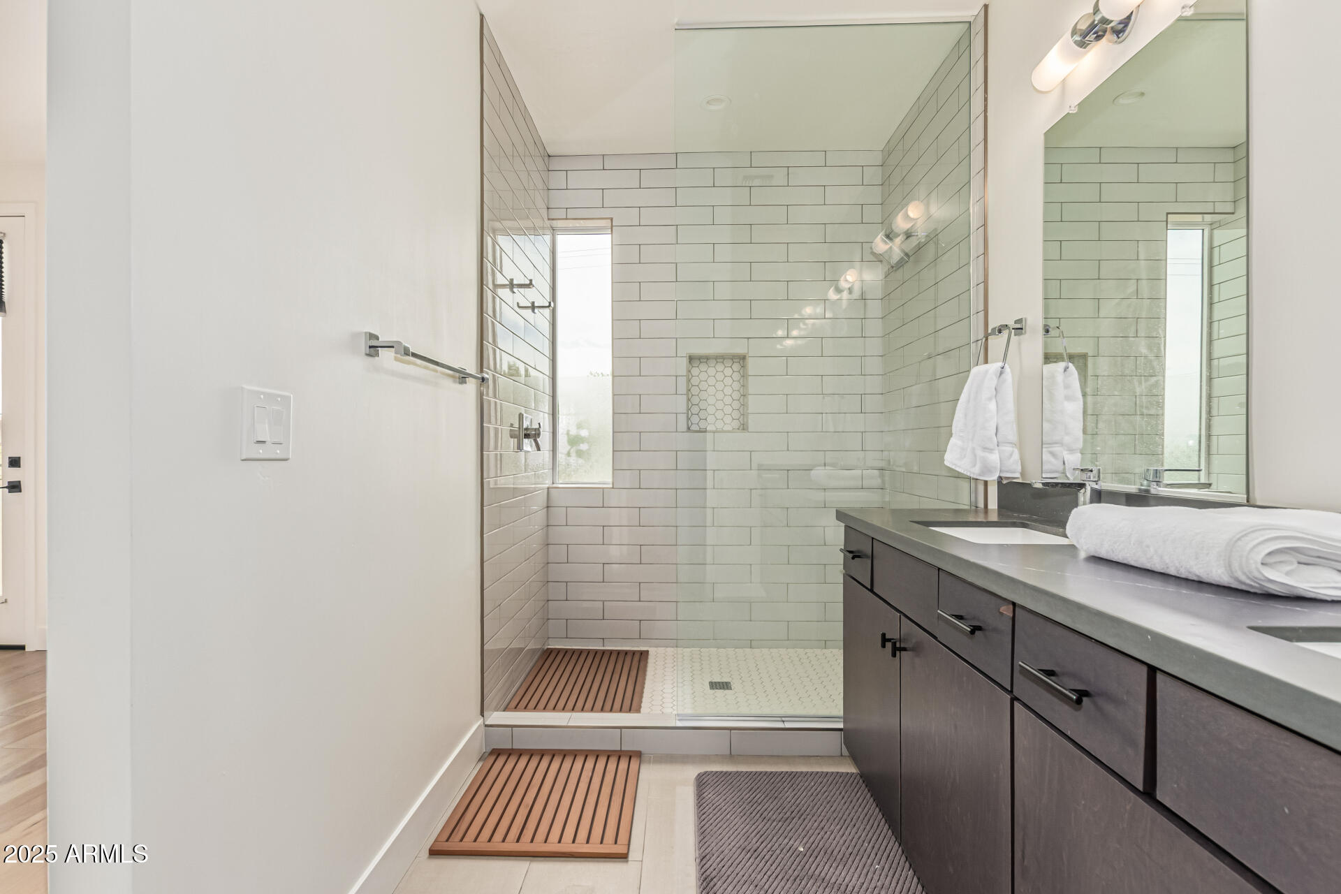 5151 North 13th Place, Unit 12 Phoenix, AZ 85014 - Photo 17 of 31 a bathroom with a sink and a mirror