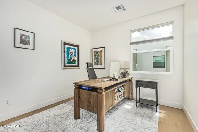 a view of a room that has a couch and a table in it