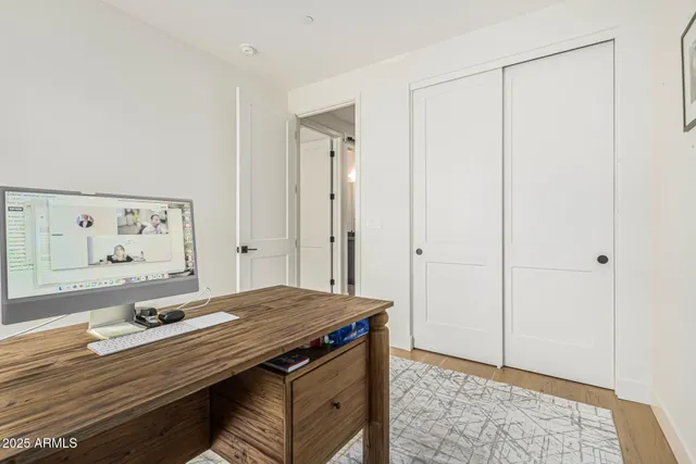 a view of room with wooden floor