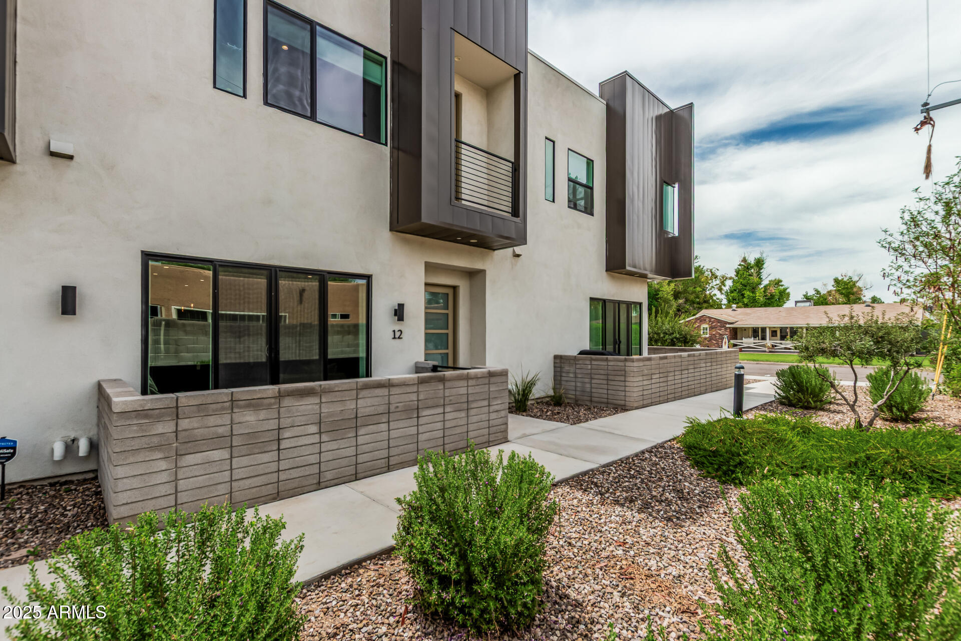5151 North 13th Place, Unit 12 Phoenix, AZ 85014 - Photo 2 of 31 a view of an house with a garden
