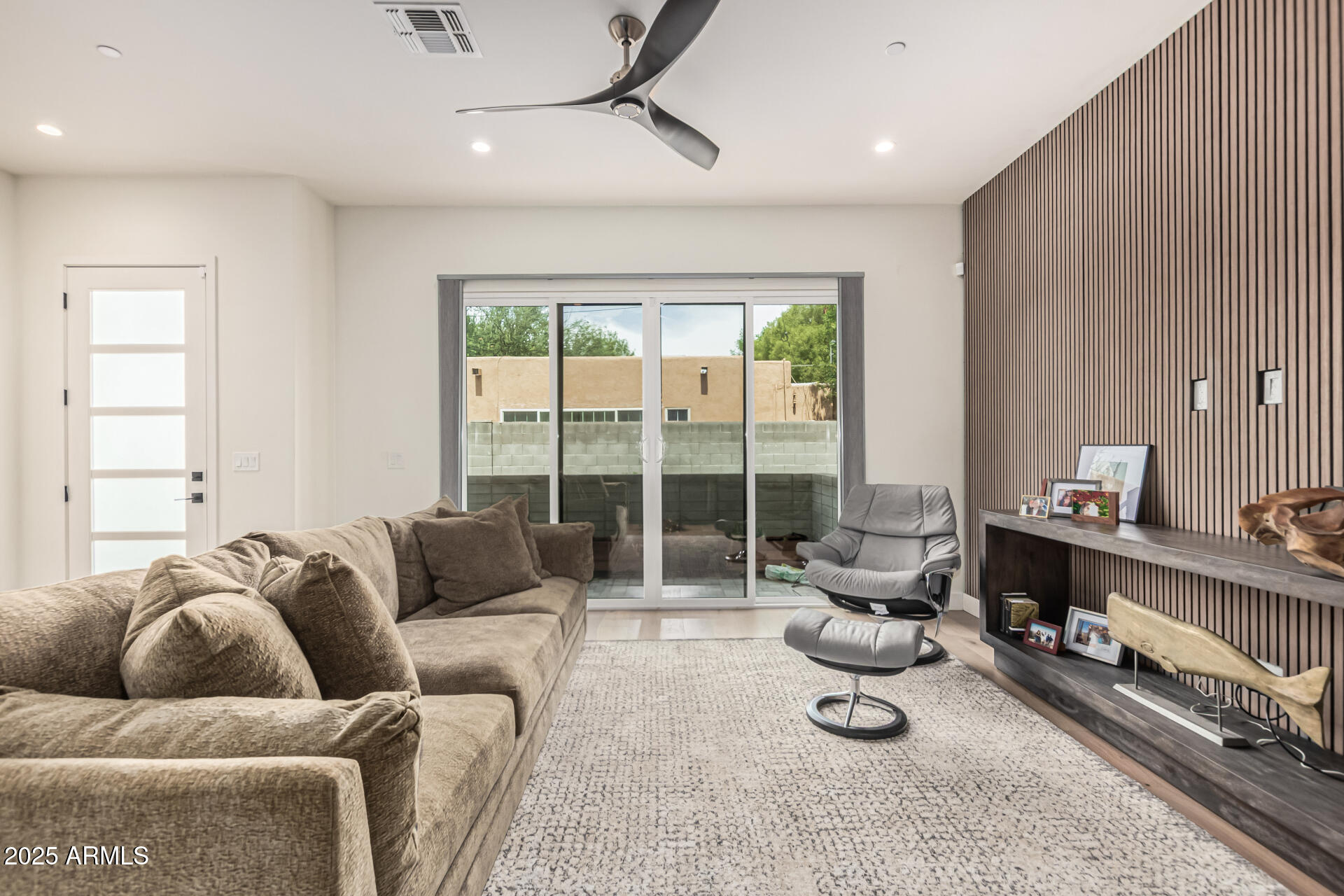 5151 North 13th Place, Unit 12 Phoenix, AZ 85014 - Photo 5 of 31 a living room with furniture a floor to ceiling window and couch