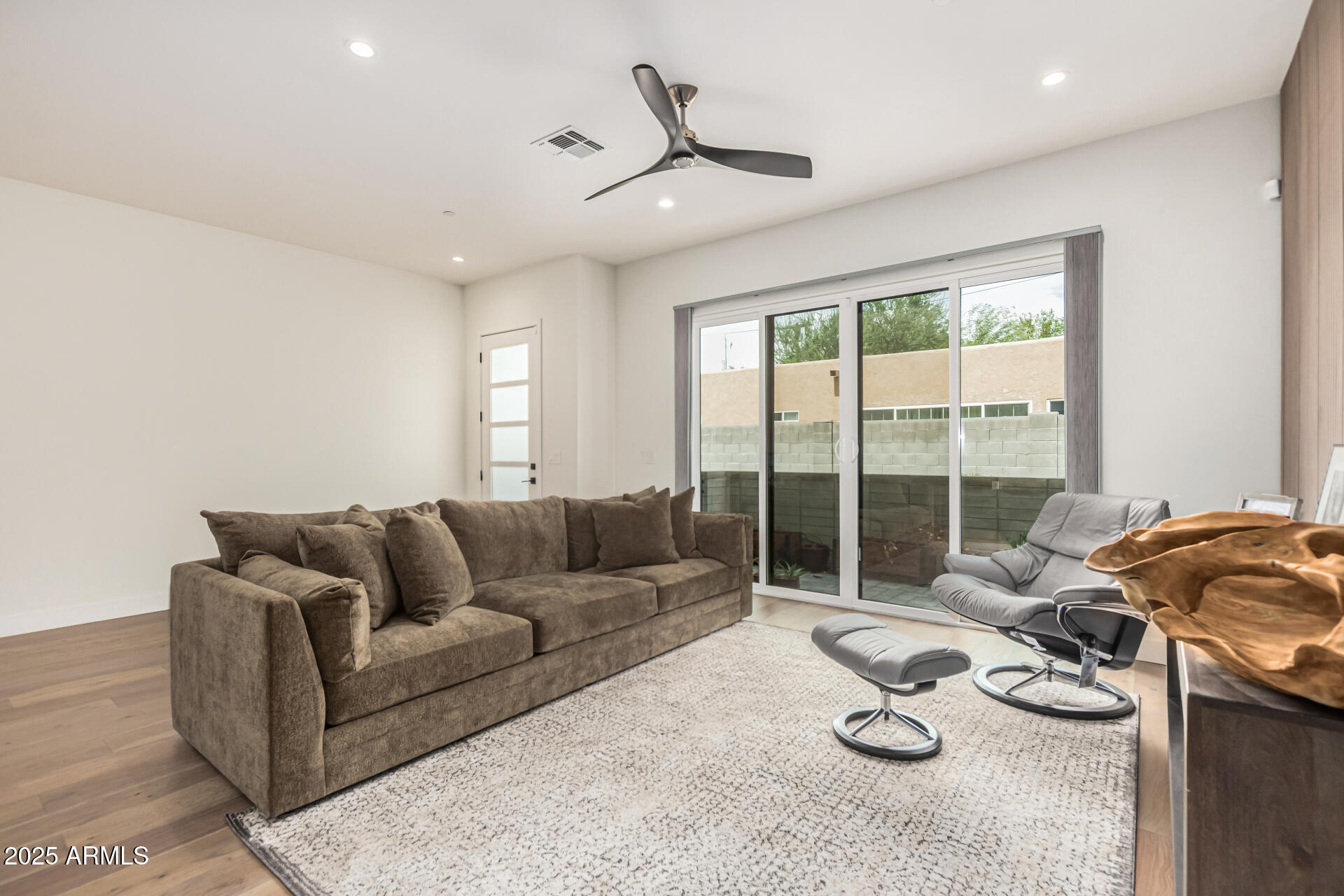 5151 North 13th Place, Unit 12 Phoenix, AZ 85014 - Photo 6 of 31 a living room with furniture and a floor to ceiling window