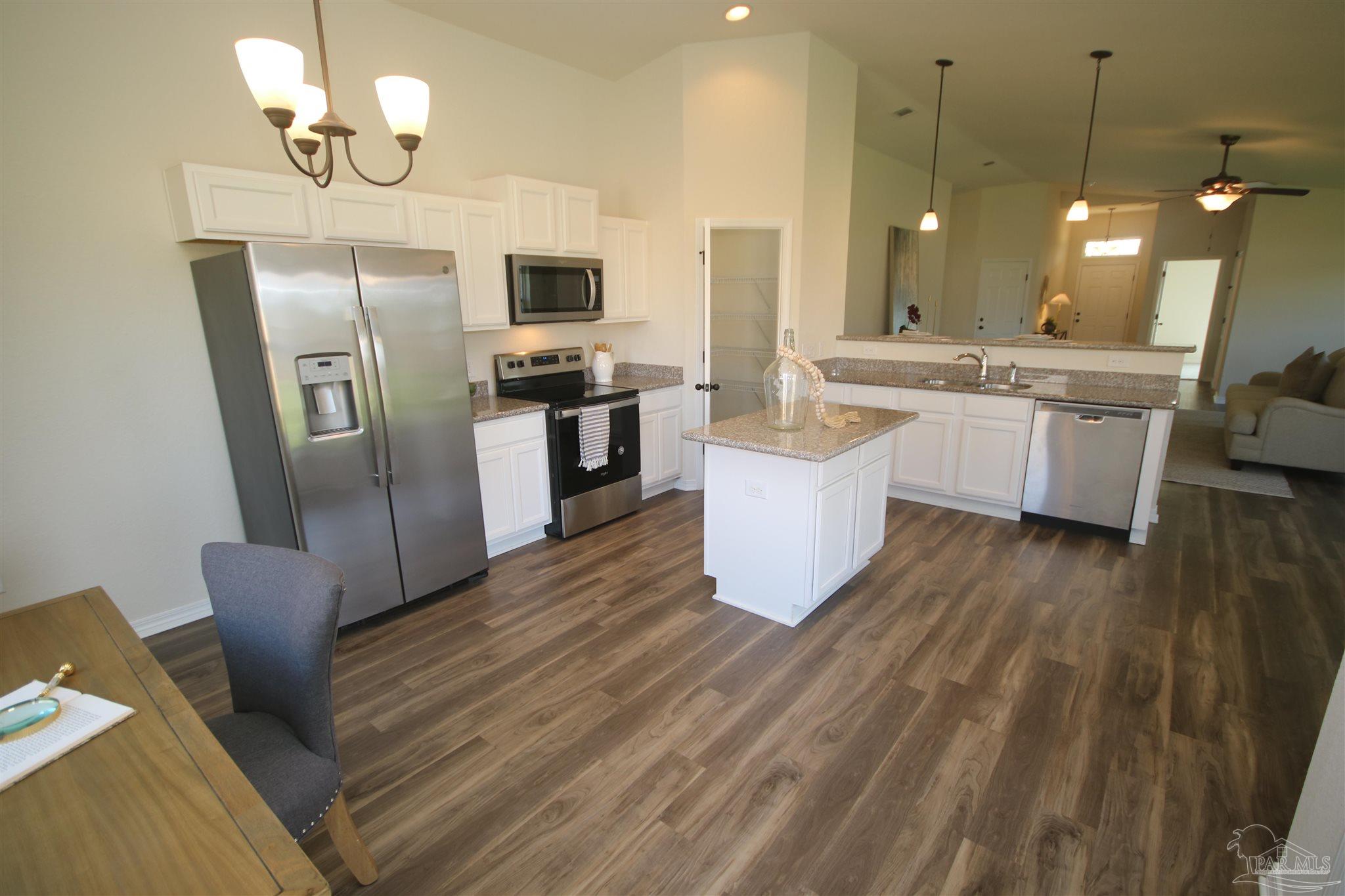 5747 Peach Drive Pace, FL 32571 - Photo 13 of 65 with a lighted walk in pantry.