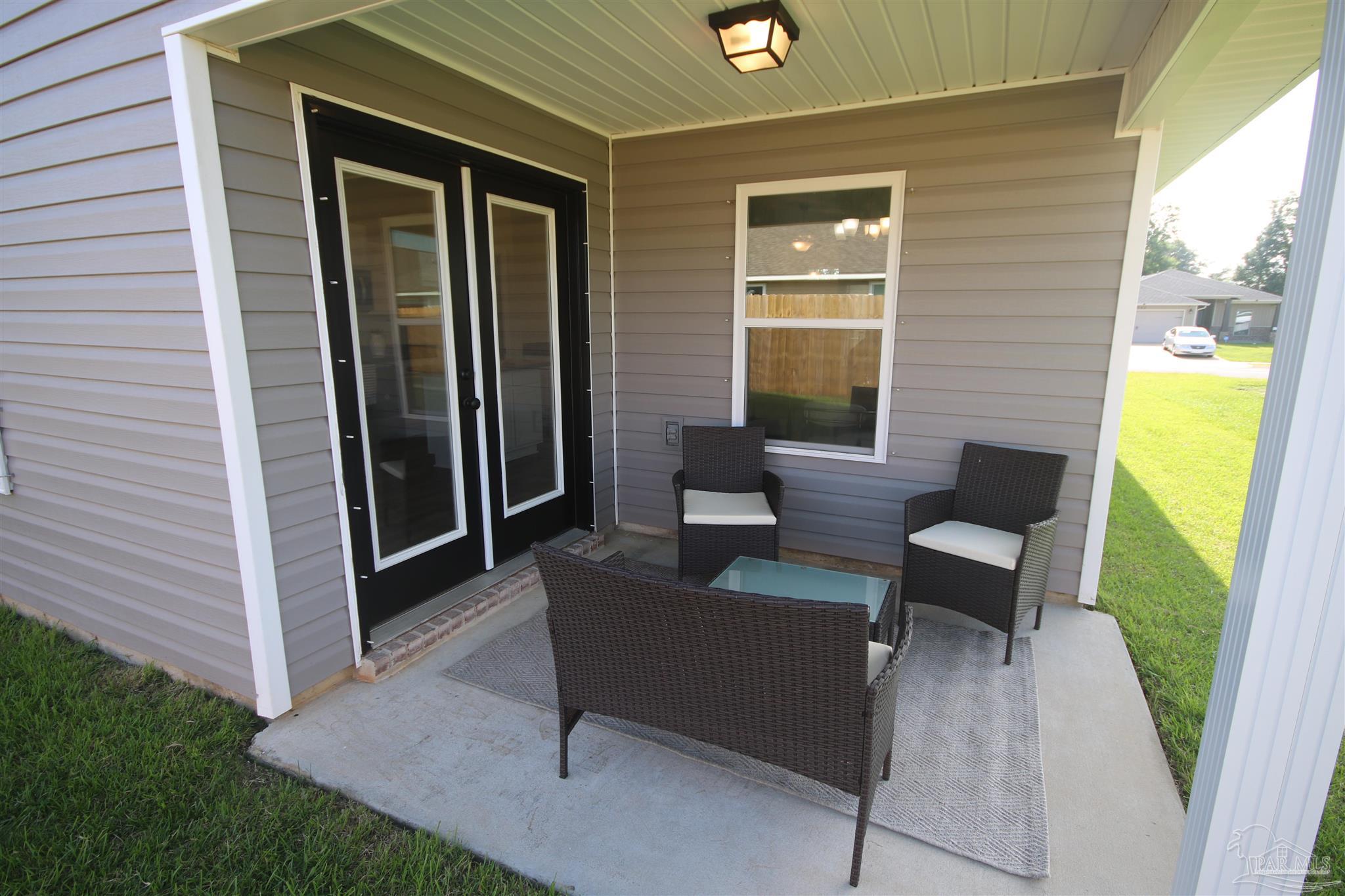 5747 Peach Drive Pace, FL 32571 - Photo 47 of 65 patio just off the kitchen outdoor dining.