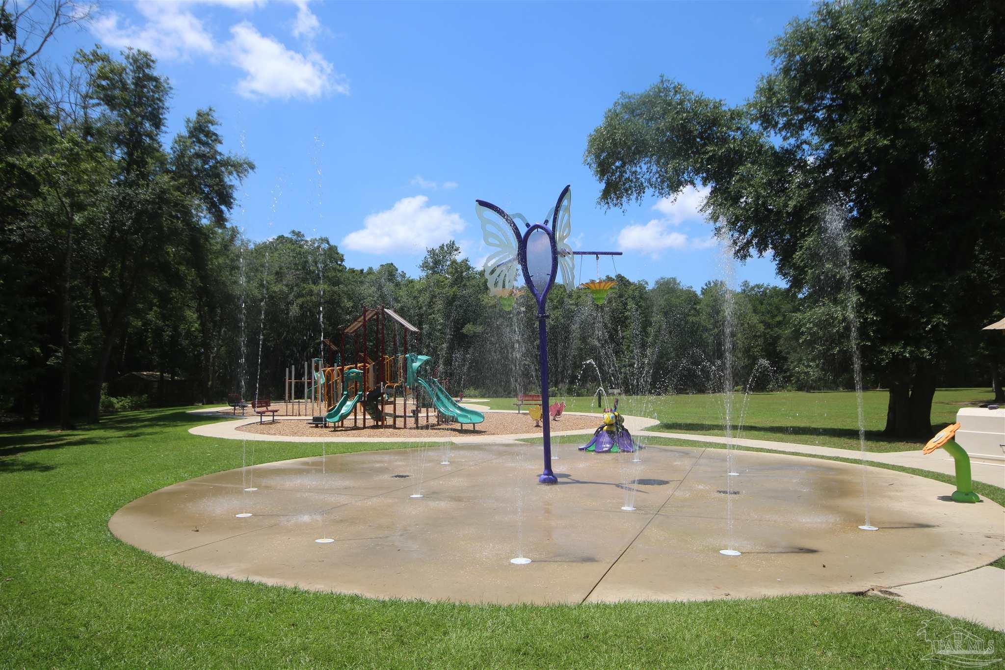 5747 Peach Drive Pace, FL 32571 - Photo 57 of 65 behind the splash pad.