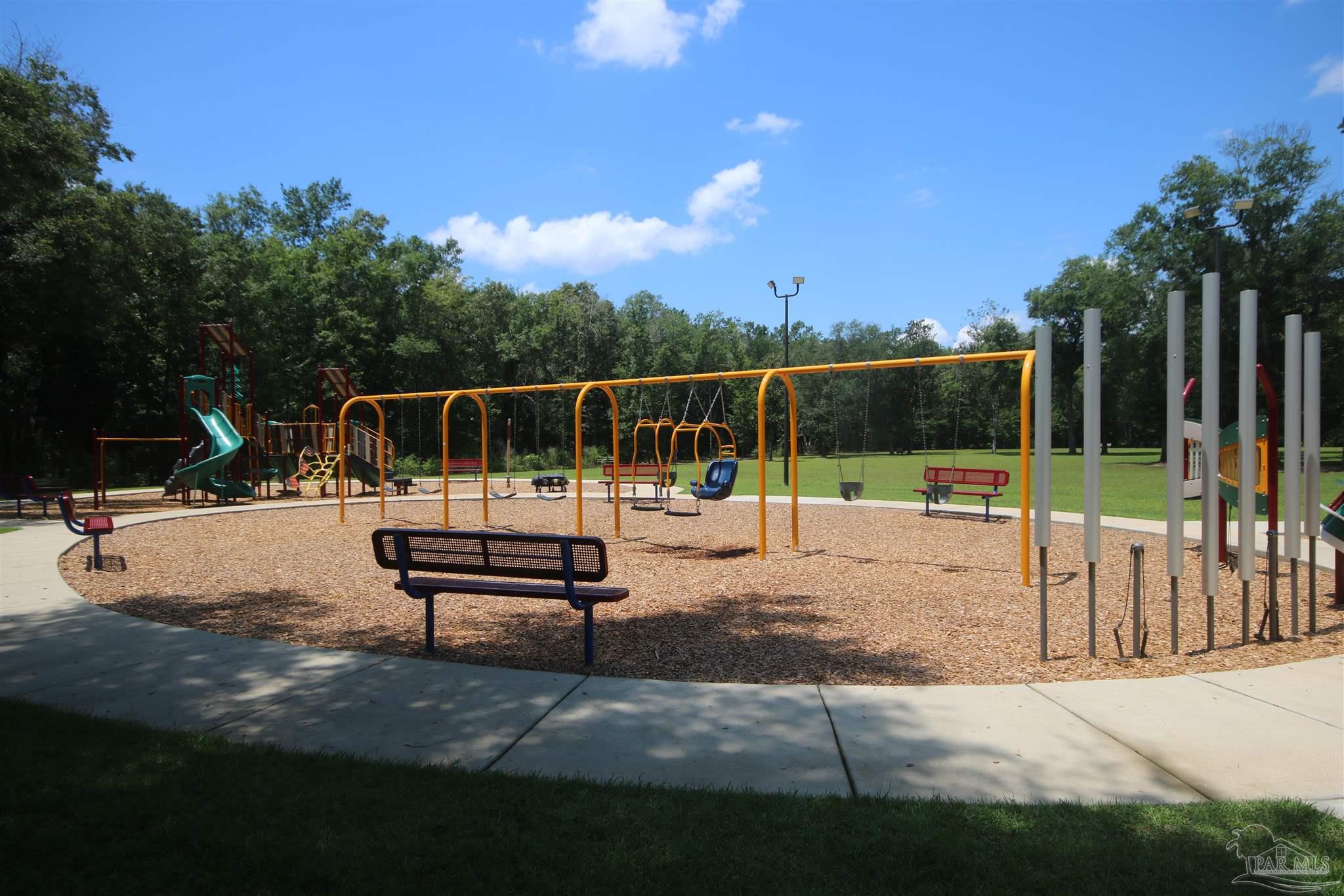 5747 Peach Drive Pace, FL 32571 - Photo 59 of 65 park benches throughout the park area.