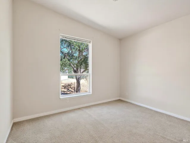 an empty room with closet area