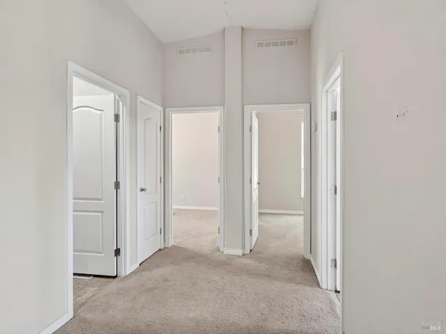 a balcony with wooden floor and fence
