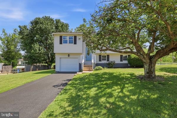 3496 Fox Ridge Court Dover, PA 17315 - Photo 1 of 35 a front view of a house with a yard and garage