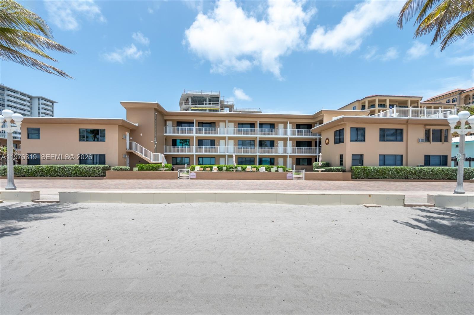 3300 North Surf Road, Unit 26A Hollywood, FL 33019 - Photo 17 of 19 a view of building with a street