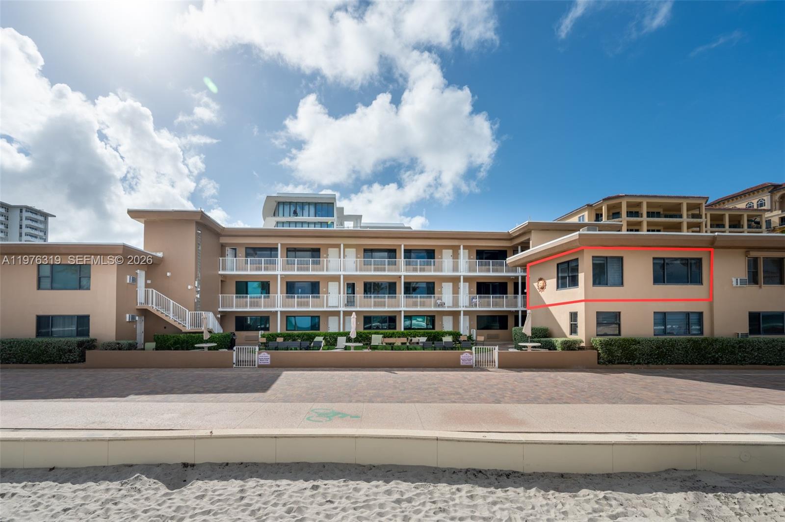 3300 North Surf Road, Unit 26A Hollywood, FL 33019 - Photo 18 of 19 a front view of a building with lot of cars and trees
