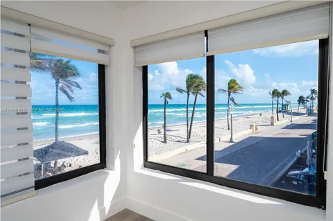 a view of a floor to ceiling window in an empty room