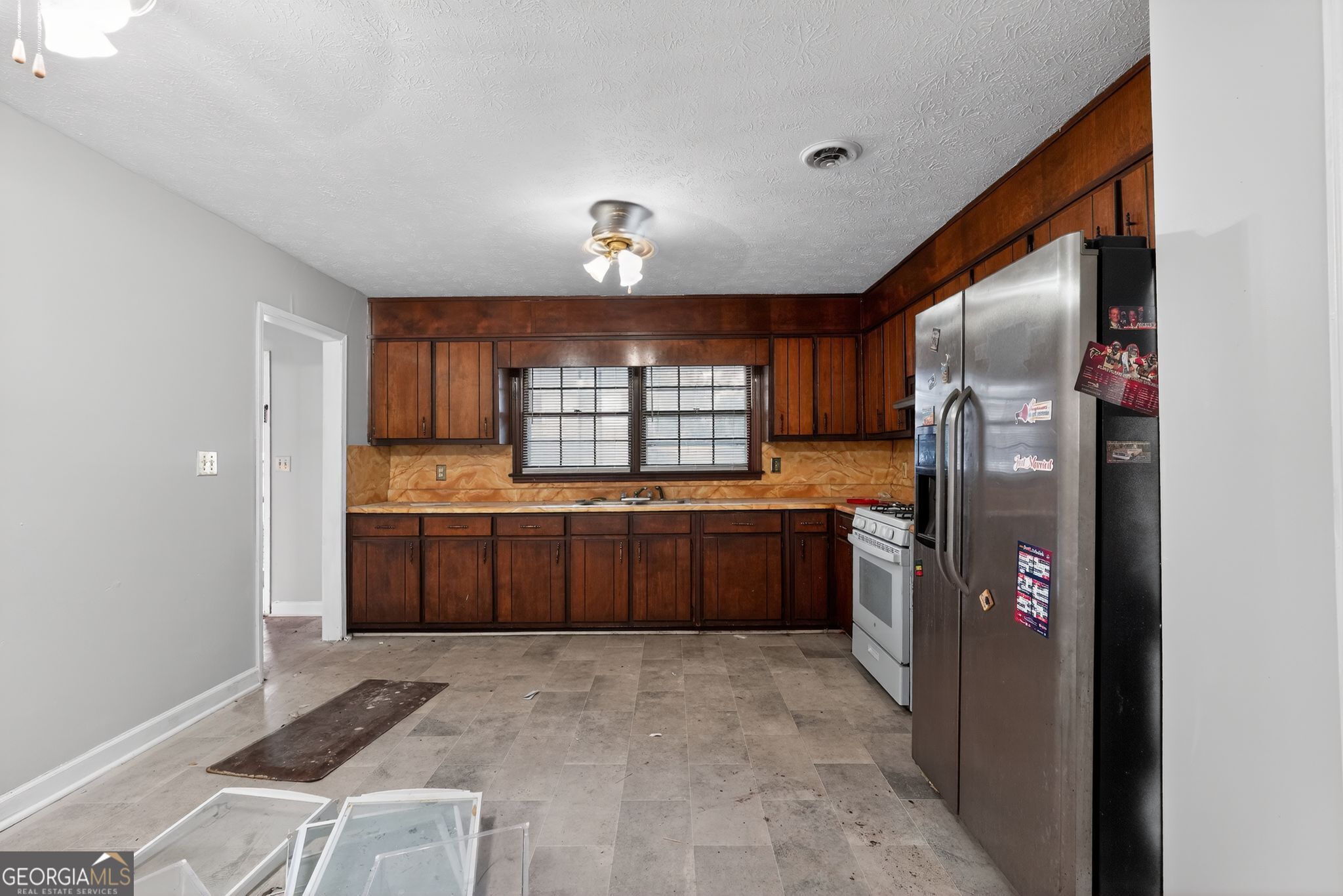 2653 Lester Street Atlanta, GA 30344 - Photo 13 of 34 a kitchen with stainless steel appliances granite countertop a refrigerator and stove