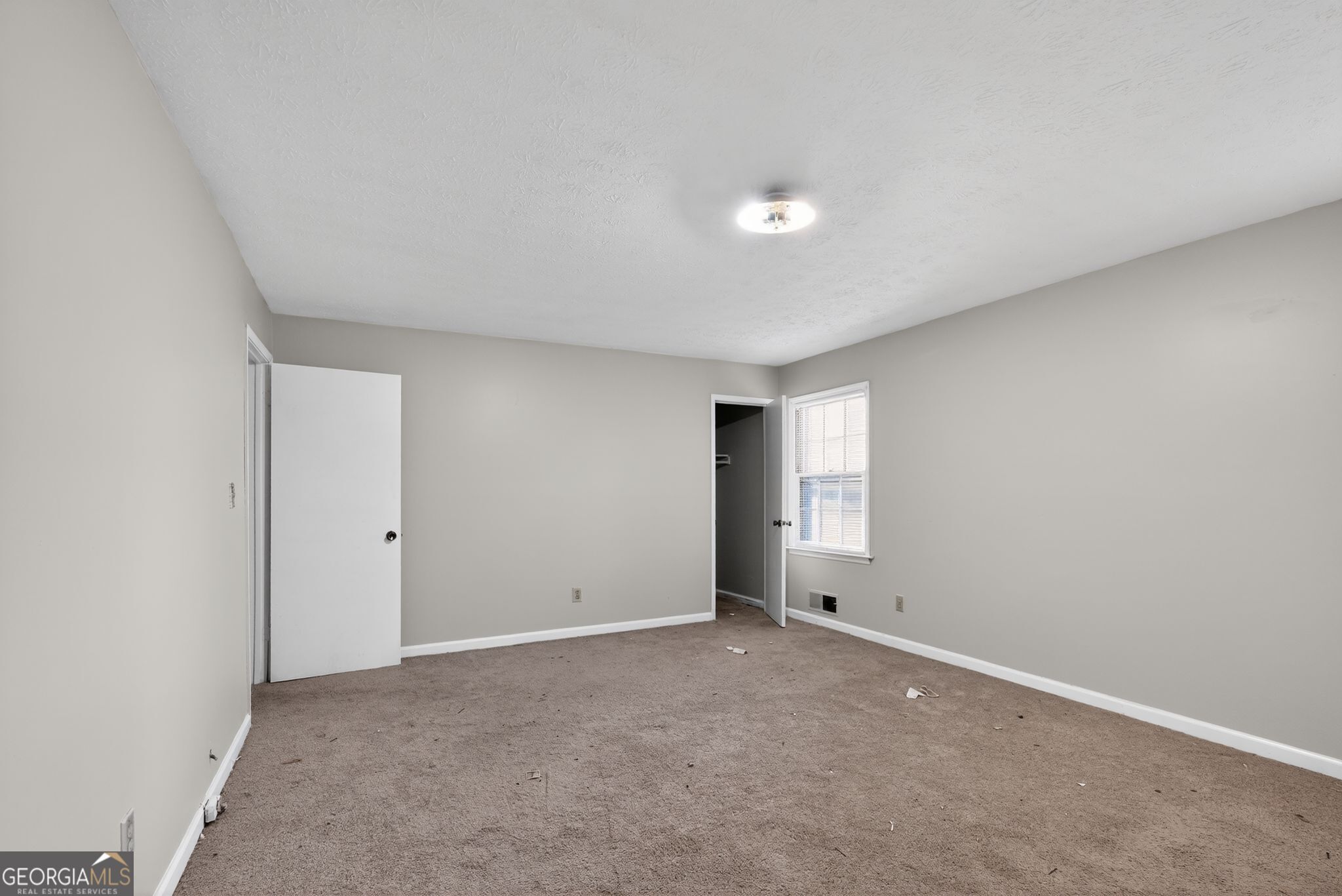 2653 Lester Street Atlanta, GA 30344 - Photo 16 of 34 a view of an empty room with window and closet area