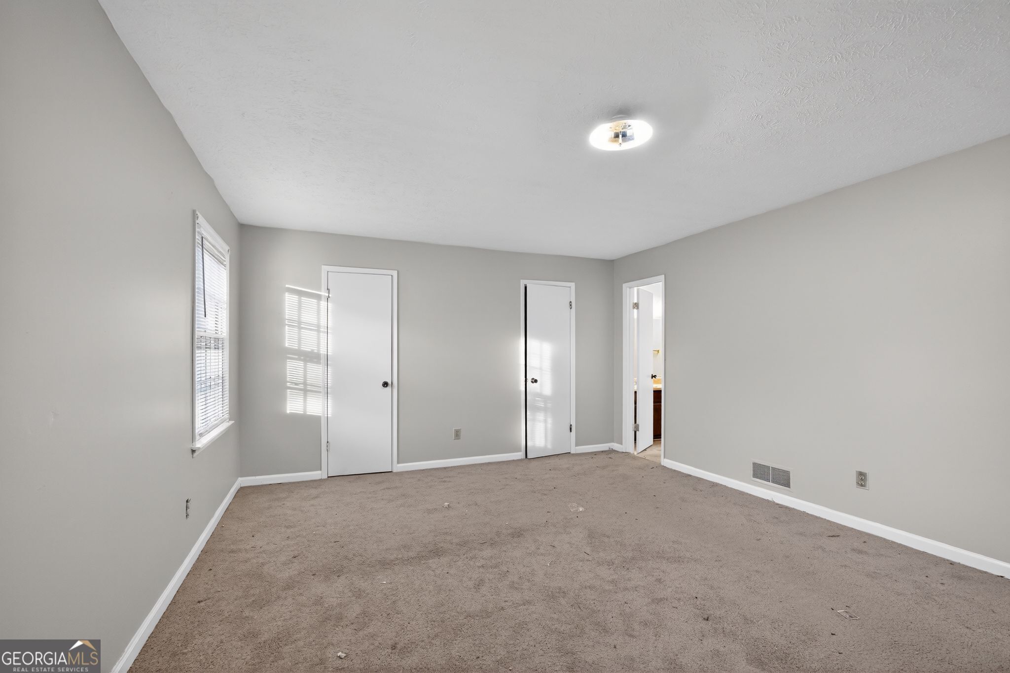 2653 Lester Street Atlanta, GA 30344 - Photo 18 of 34 a view of an empty room with a window