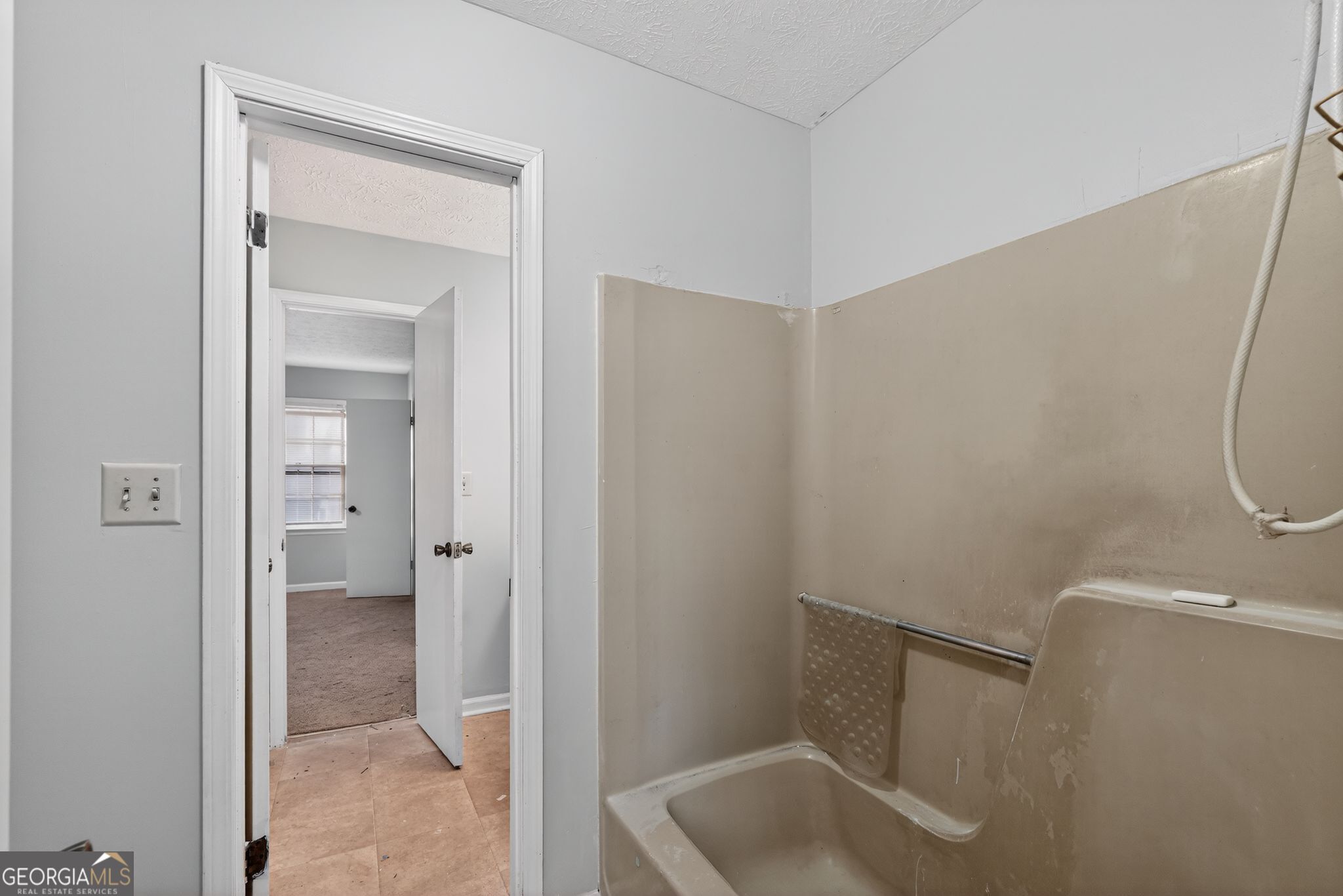 2653 Lester Street Atlanta, GA 30344 - Photo 21 of 34 a bathroom with a sink and glass door shower