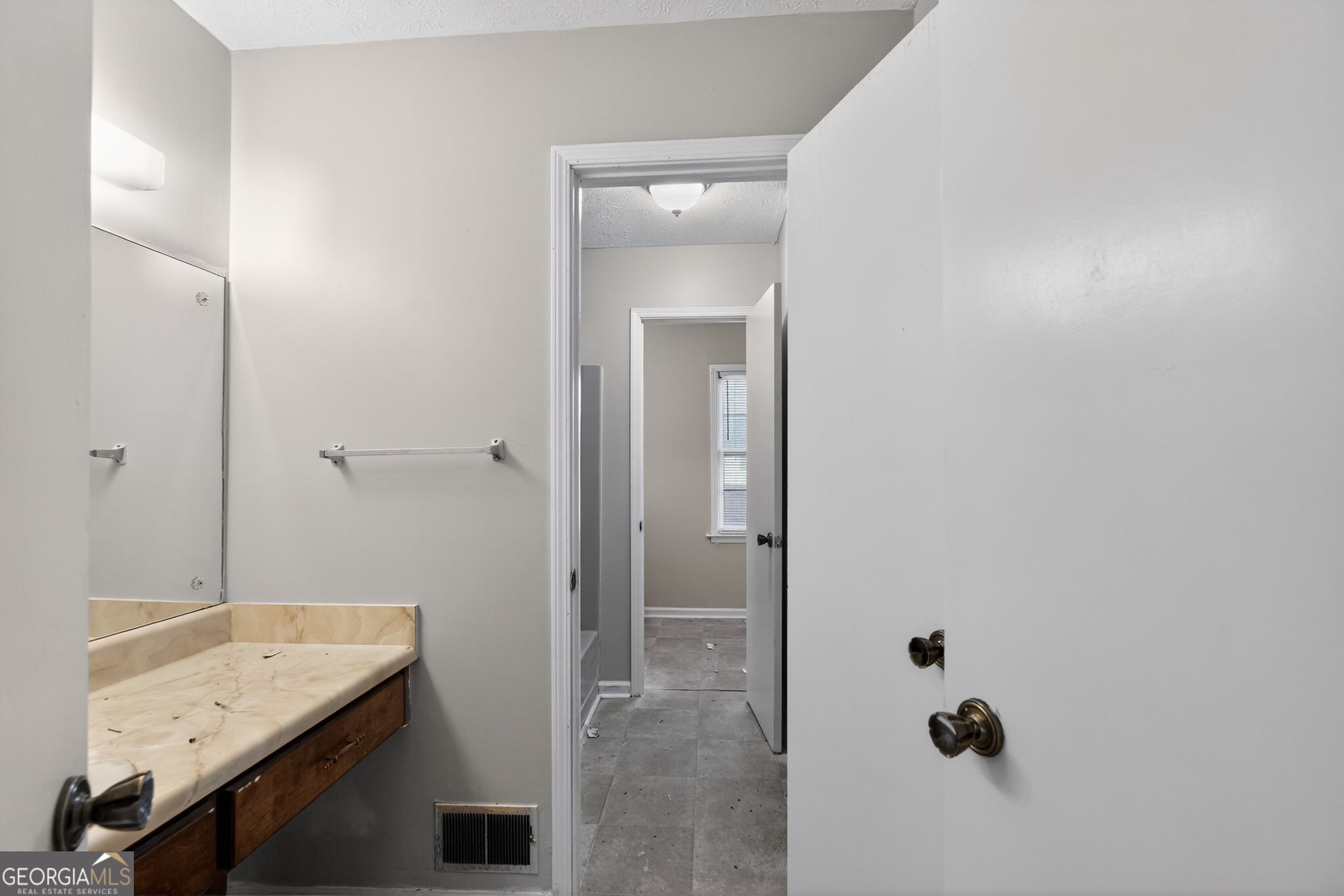 2653 Lester Street Atlanta, GA 30344 - Photo 24 of 34 a bathroom with a granite countertop sink