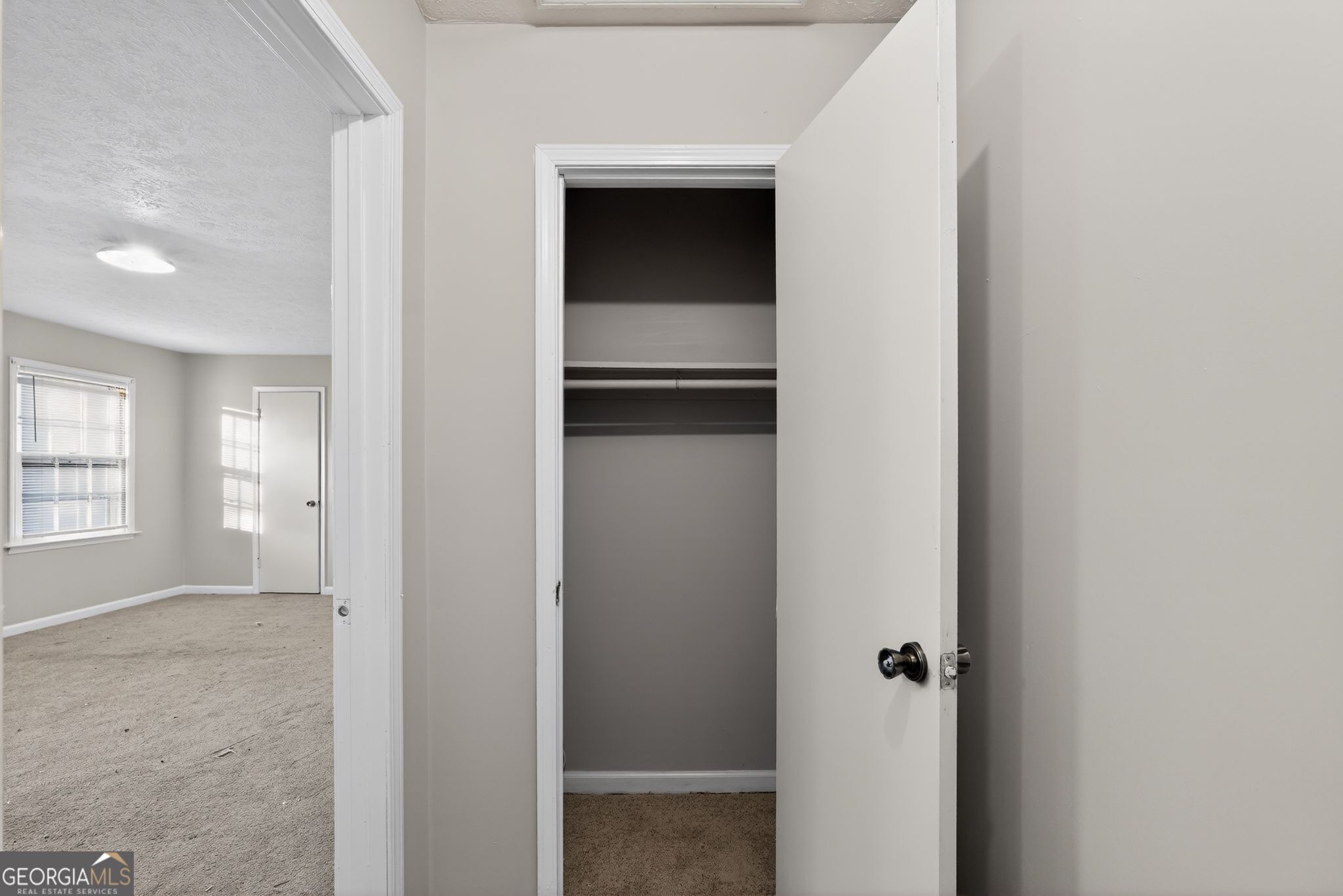 2653 Lester Street Atlanta, GA 30344 - Photo 26 of 34 a view of an empty room with wooden floor and a window