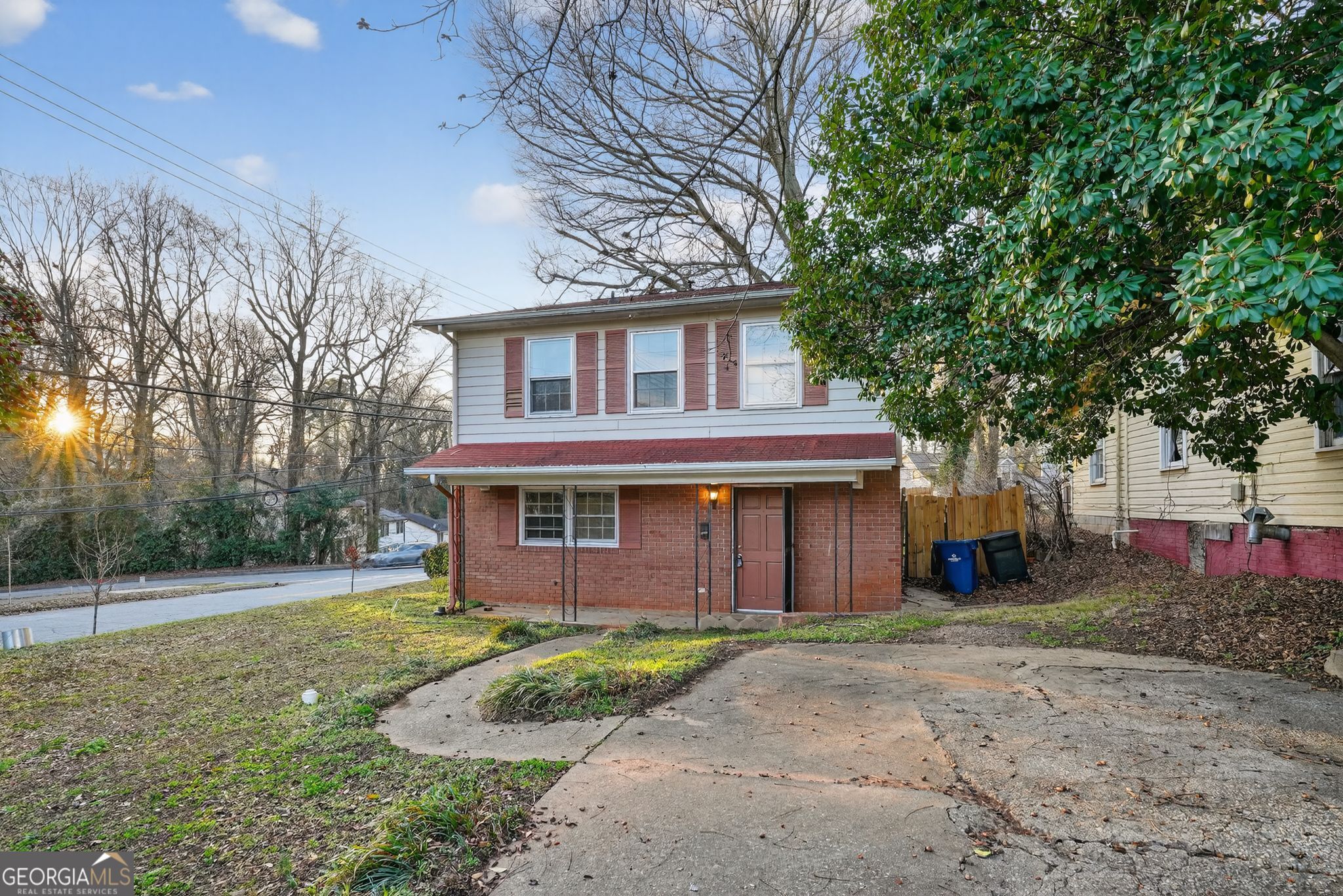 2653 Lester Street Atlanta, GA 30344 - Photo 3 of 34 a front view of a house with a yard and garage