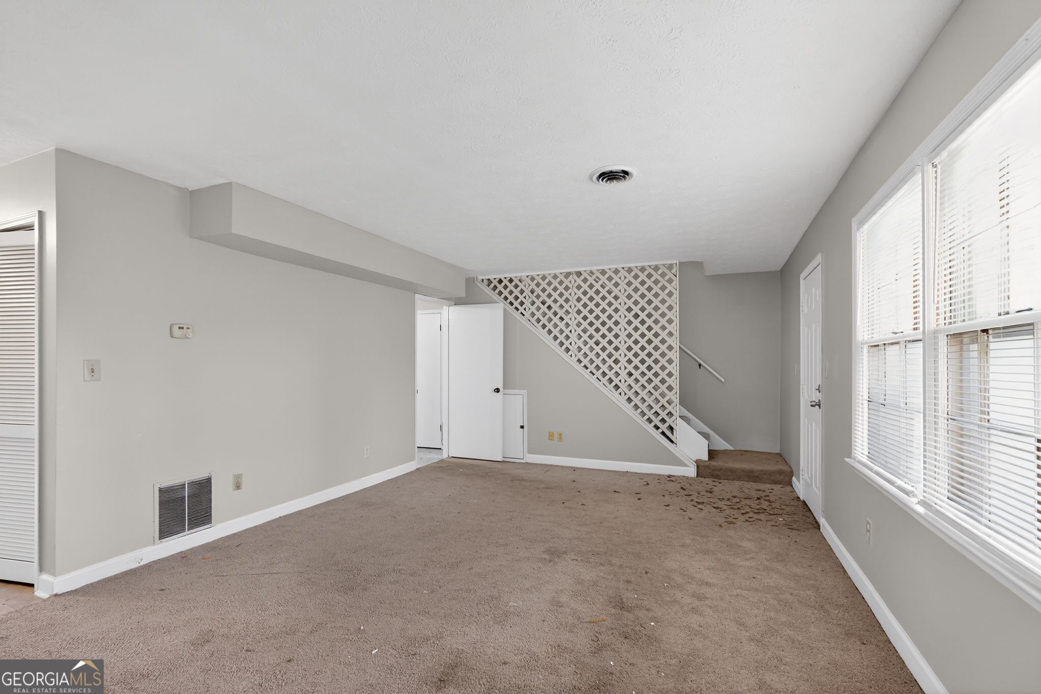 2653 Lester Street Atlanta, GA 30344 - Photo 8 of 34 a view of an empty room with a window