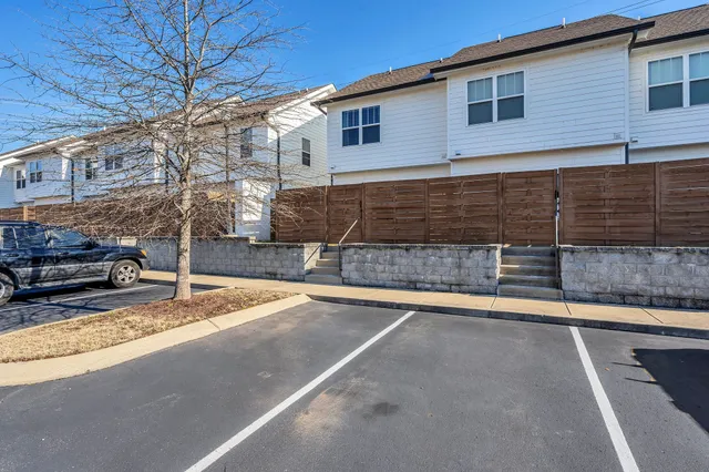 a view of a backyard with garage