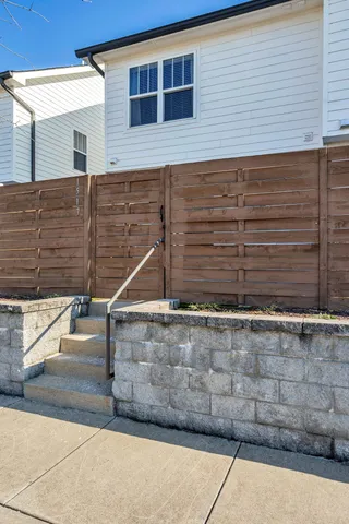 a view of a house with a small yard