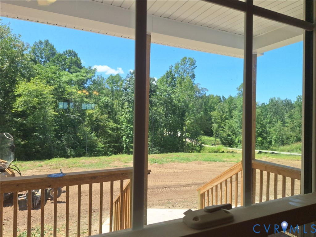 Front Expansive covered porch with wood-finish rai