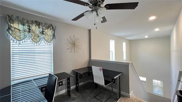 a bedroom with a bed and a television