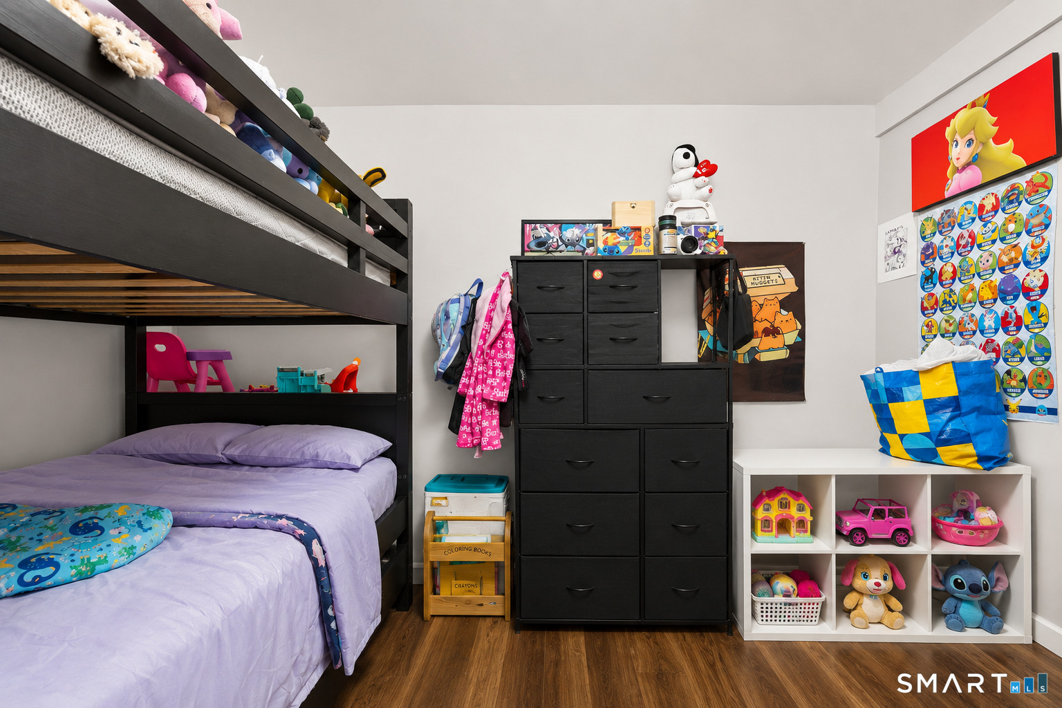 135 Prospect Street Waterbury, CT 06710 - Photo 10 of 19 a bed room with a bed a baby and a couch