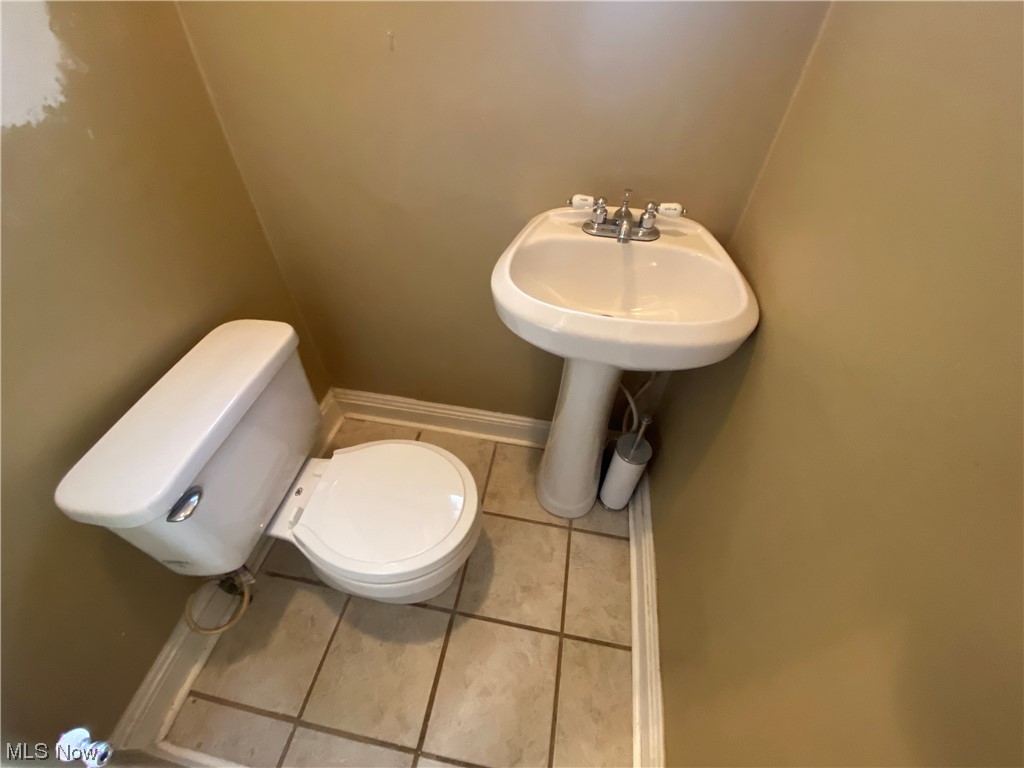 3630 Bainbridge Road Cleveland Heights, OH 44118 - Photo 10 of 21 Bathroom featuring tile flooring, sink, and toilet