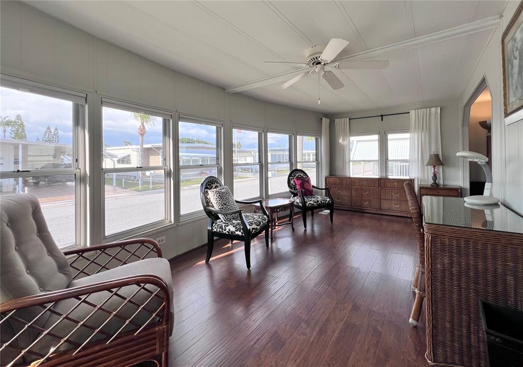 1100 South Belcher Road, Unit 772 Largo, FL 33771 - Photo 8 of 84 a living room with furniture and a large window