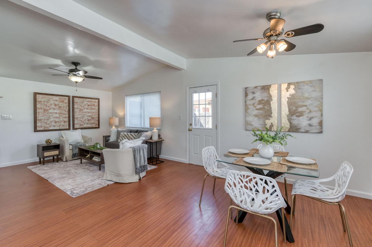 2607 Crescent Avenue Clovis, CA 93612 - Photo 13 of 26 a view of a dining room with furniture window and wooden floor