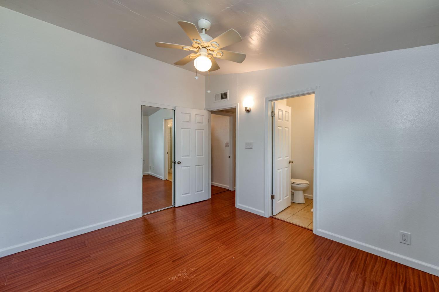 2607 Crescent Avenue Clovis, CA 93612 - Photo 18 of 26 wooden floor in an empty room with a window